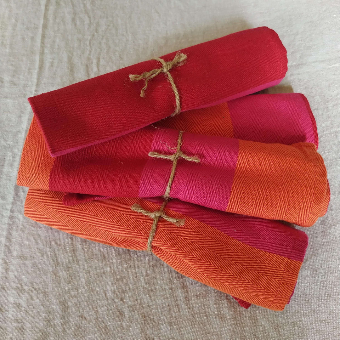 A Pair of Red Orange Pink Napkins: A Sustainable Touch of Colour to Your Table