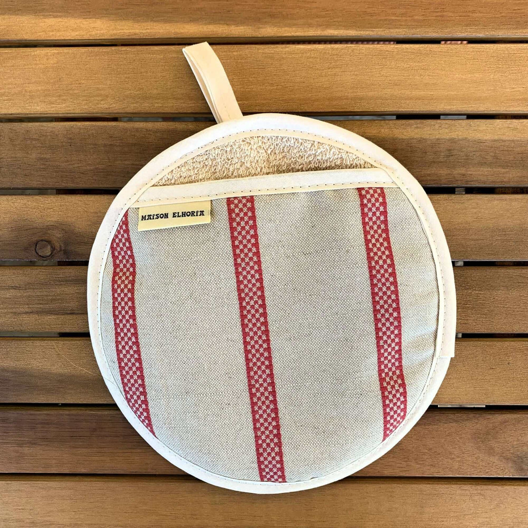 Pot holder linen union with red stripes on a wooden surface 