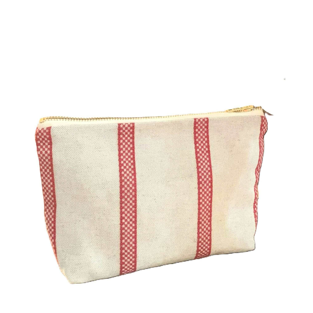 Cut image of a small toiletry bag linen union with red stripes