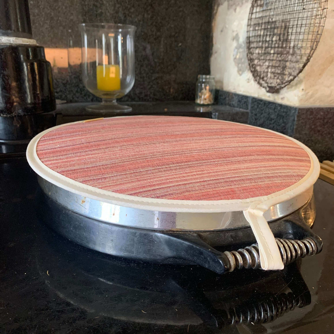 single hob cover on top of an Aga lid , red with stripes 