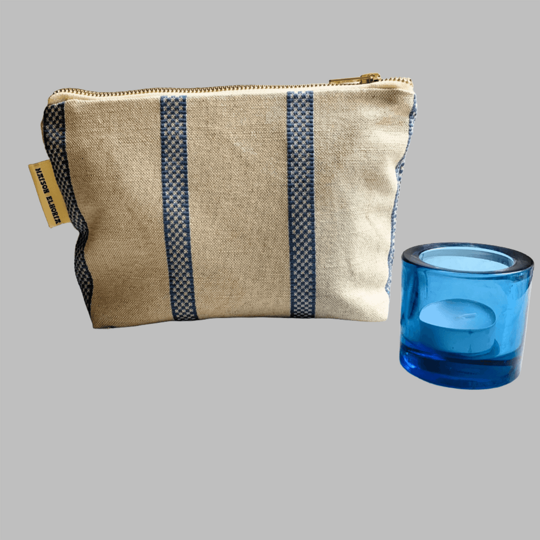 Toiletry bag for men linen union with blue stripes And a blue candle