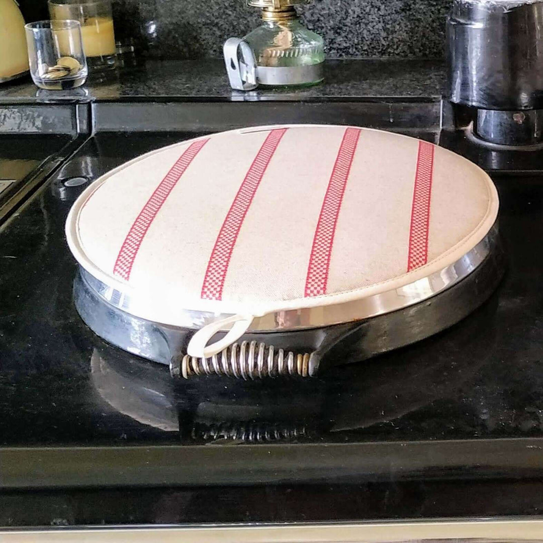 Linen union with Red stripes insulating an Aga hob plate cover