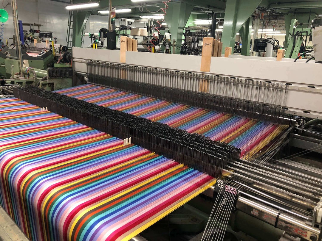 Rainbow cotton fabric being woven in a lancashire mill